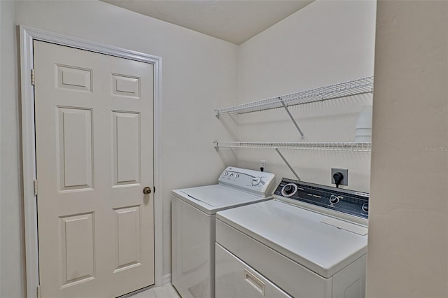 laundry room with independent washer and dryer