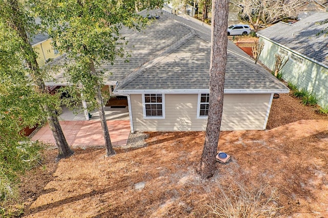 view of side of home featuring a patio area