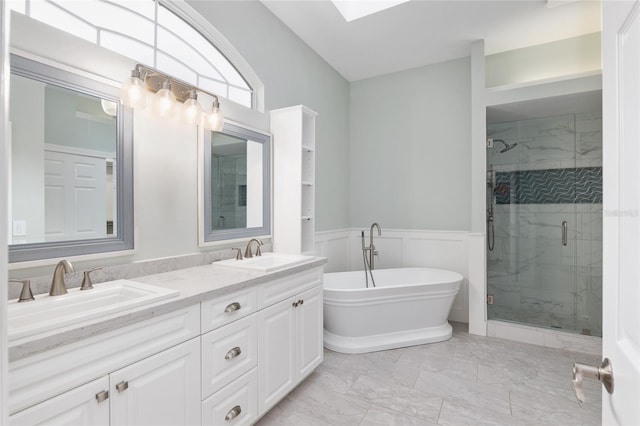 bathroom with vanity and independent shower and bath