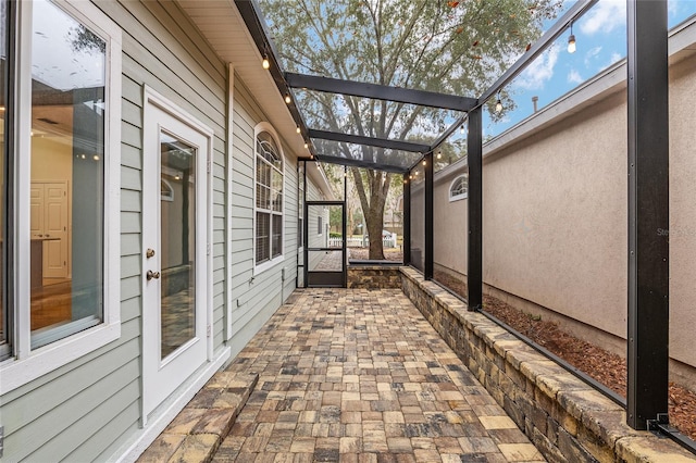 view of patio with a lanai