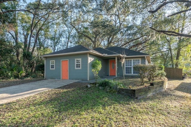 ranch-style home with a front lawn