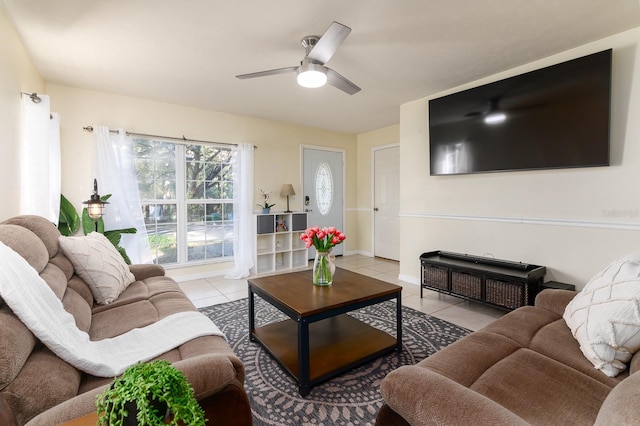 living room with light tile patterned floors and ceiling fan