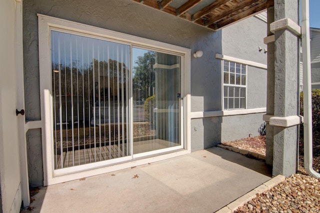 doorway to property with a patio