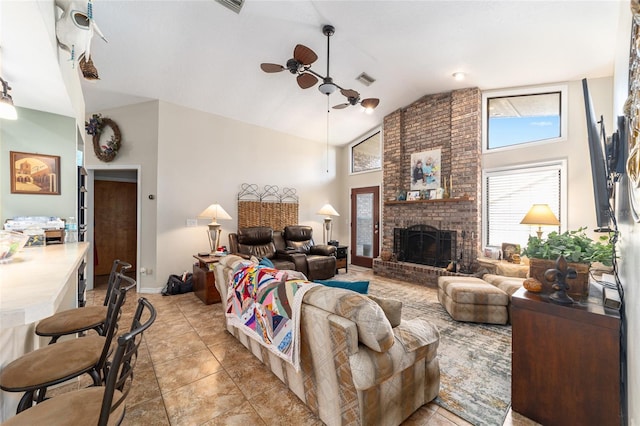 tiled living room featuring ceiling fan, a fireplace, and high vaulted ceiling