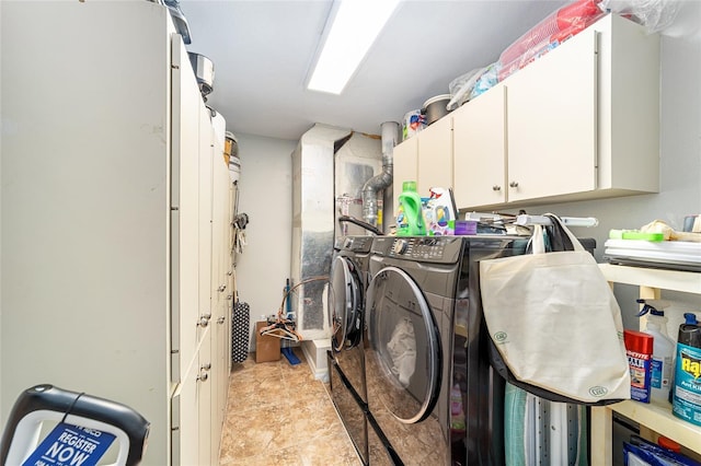 laundry room with cabinets and washer and dryer