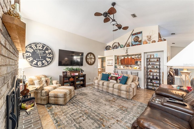 tiled living room with a brick fireplace, lofted ceiling, and ceiling fan