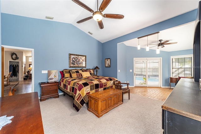 bedroom featuring light carpet, access to outside, lofted ceiling, and ceiling fan