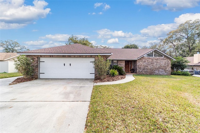 single story home featuring a garage and a front lawn