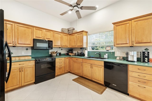 kitchen featuring sink, light tile patterned floors, ceiling fan, decorative backsplash, and black appliances