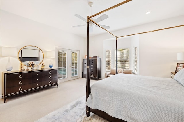 carpeted bedroom featuring access to outside, french doors, and ceiling fan