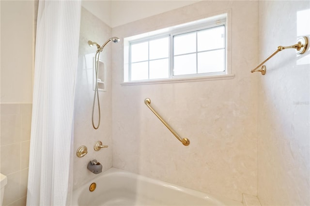 bathroom with shower / bath combo