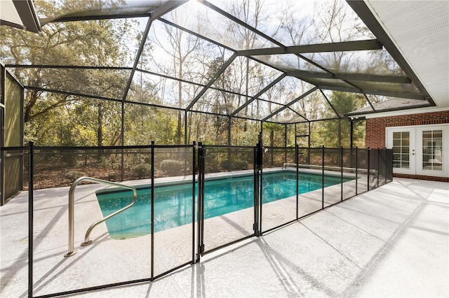 view of pool featuring french doors, a lanai, and a patio