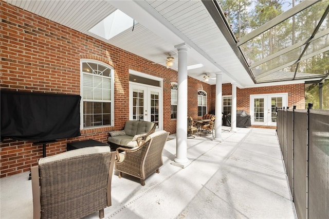 view of patio with french doors, ceiling fan, an outdoor living space, and area for grilling