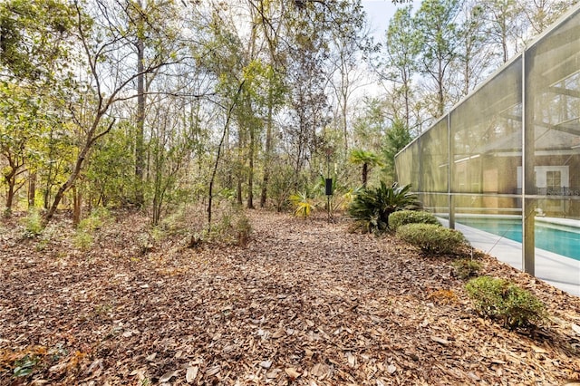 view of yard featuring a lanai