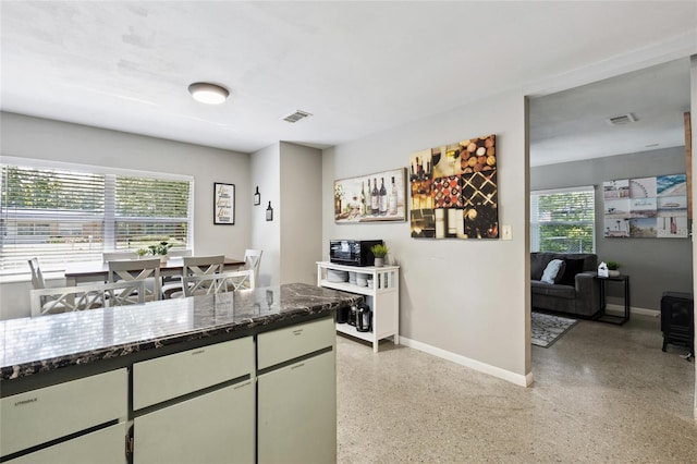 kitchen with dark stone counters