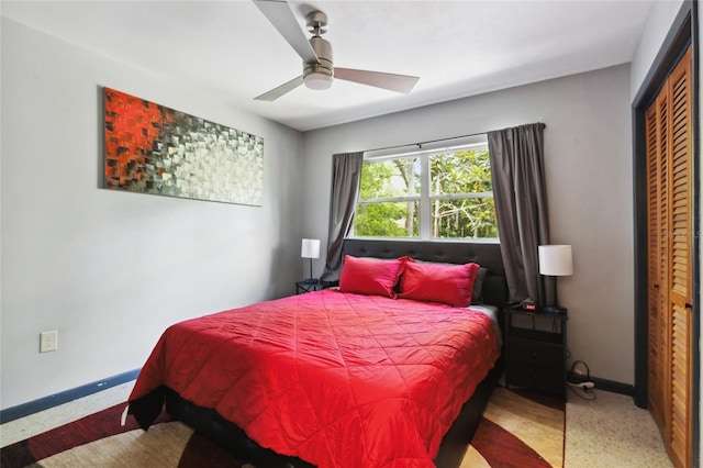 bedroom featuring ceiling fan and a closet