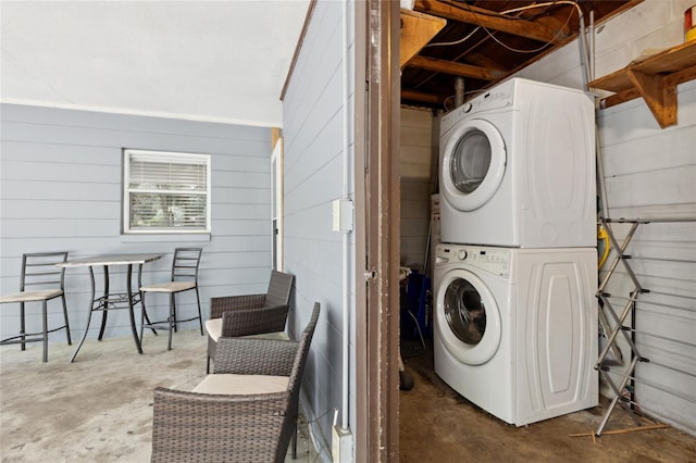 laundry room with stacked washer and clothes dryer