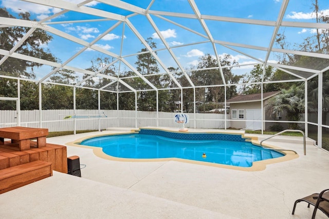 view of swimming pool featuring a lanai and a patio