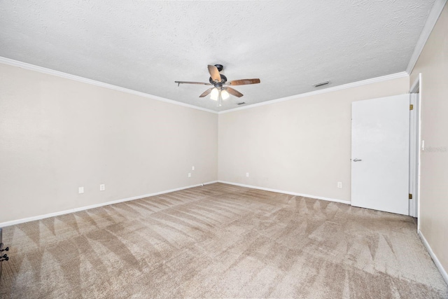 carpeted spare room featuring ceiling fan, crown molding, and a textured ceiling