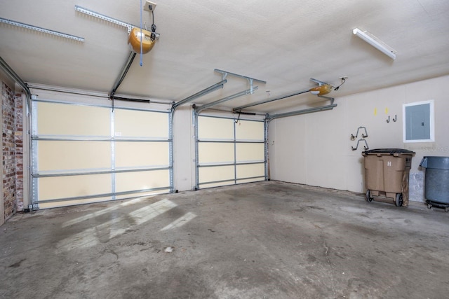 garage featuring a garage door opener and electric panel