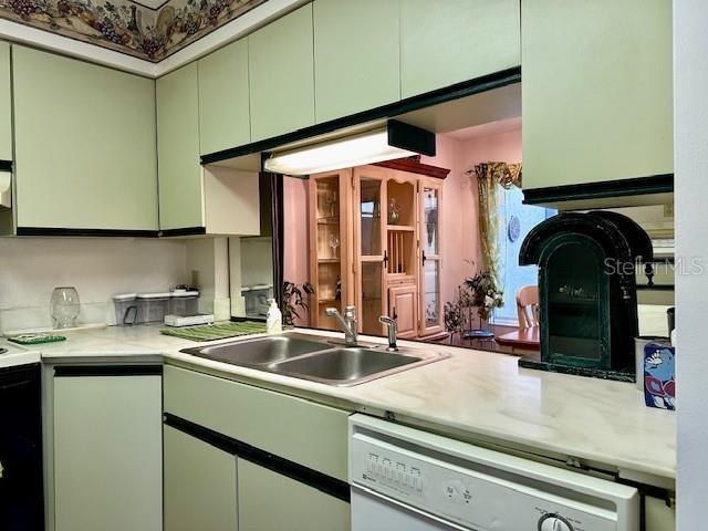 kitchen with dishwasher, stove, and sink