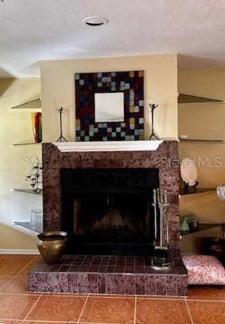 interior details with a brick fireplace