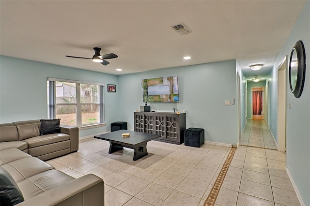 tiled living room featuring ceiling fan