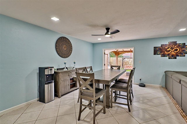 dining area featuring light tile patterned floors and ceiling fan