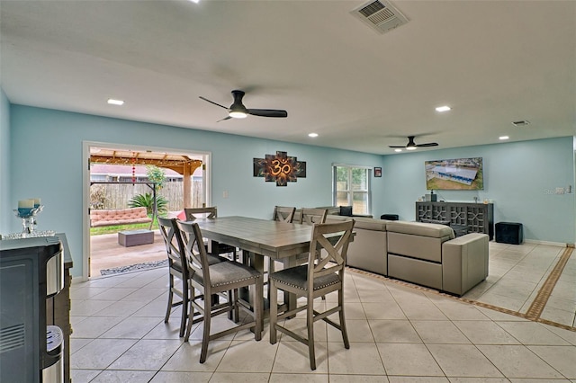 dining room with light tile patterned floors and ceiling fan