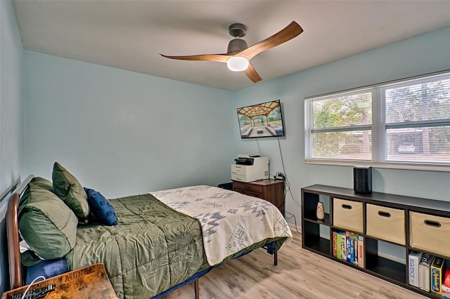 bedroom featuring light hardwood / wood-style flooring and ceiling fan