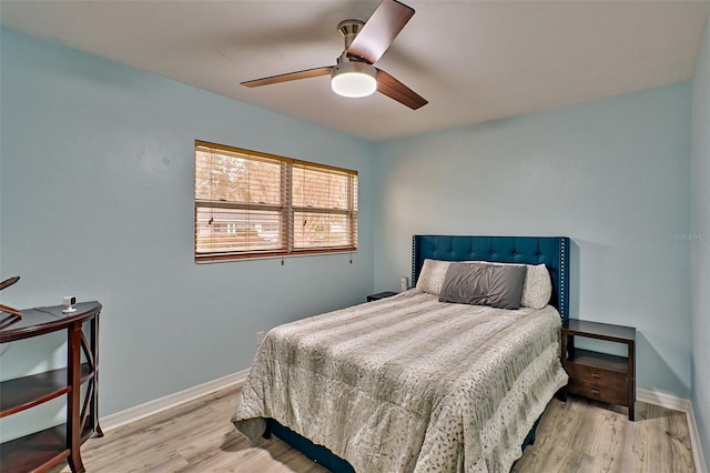 bedroom with ceiling fan and light wood-type flooring