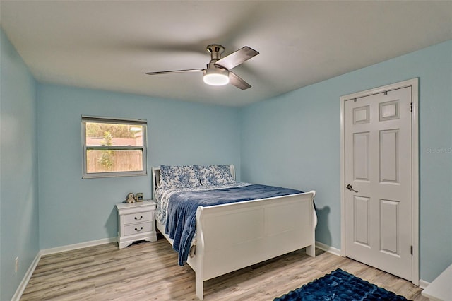 bedroom with ceiling fan and light hardwood / wood-style floors