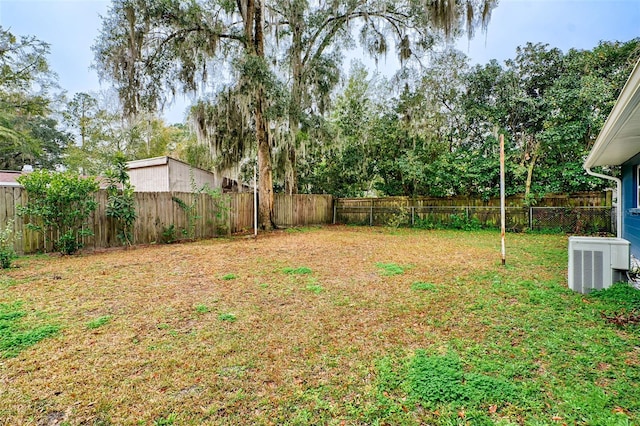 view of yard featuring central air condition unit