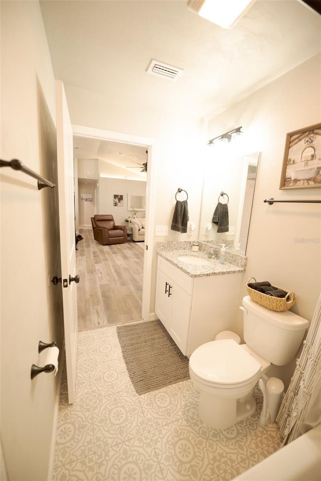 bathroom with vanity and toilet