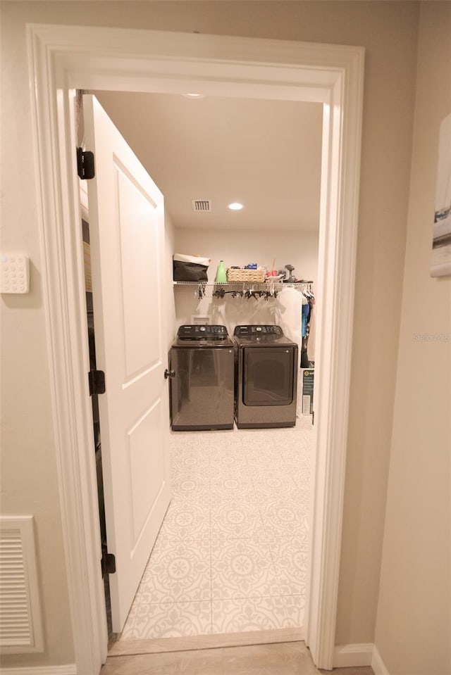 laundry room featuring washer and clothes dryer