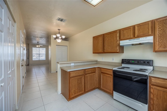 kitchen with hanging light fixtures, electric range, kitchen peninsula, and light tile patterned floors