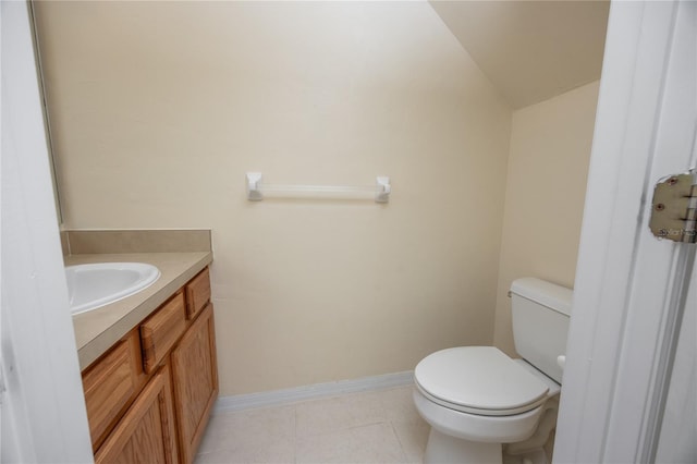 bathroom with vanity, vaulted ceiling, and toilet