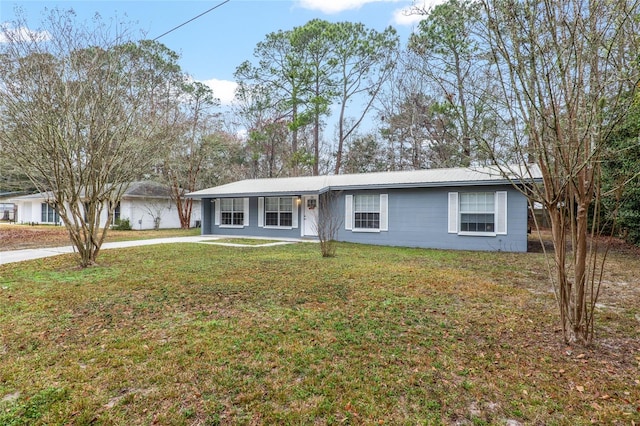 single story home with a carport and a front lawn