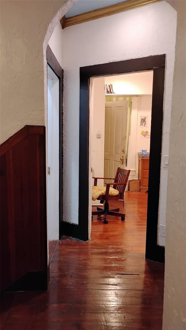 hall featuring dark hardwood / wood-style flooring and ornamental molding