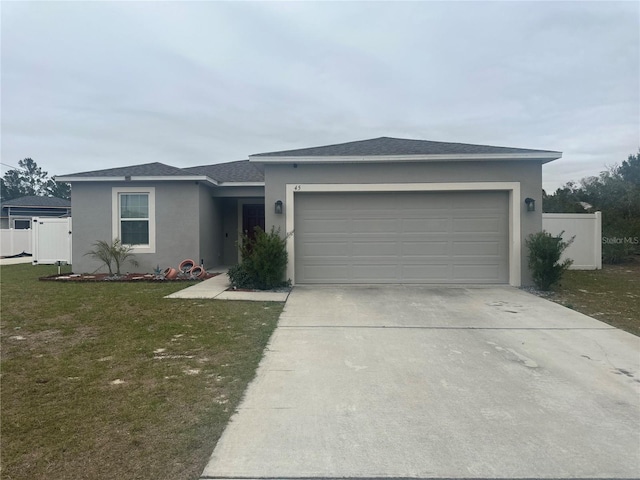 ranch-style house with a garage and a front yard