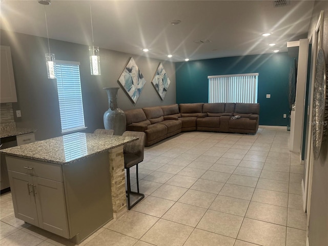 living room with light tile patterned floors