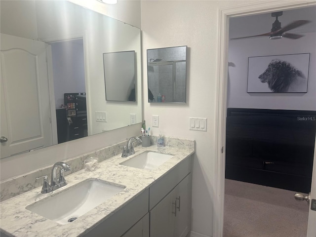 bathroom with ceiling fan and vanity