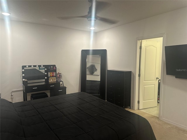 bedroom featuring ceiling fan and light colored carpet