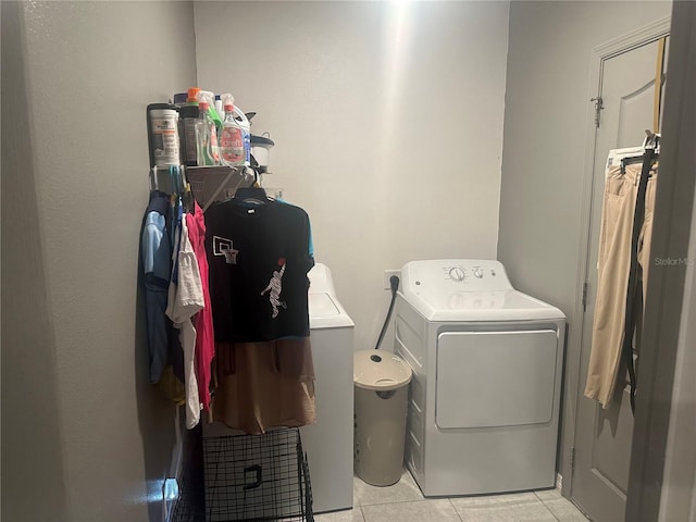 washroom with light tile patterned flooring and washer / clothes dryer