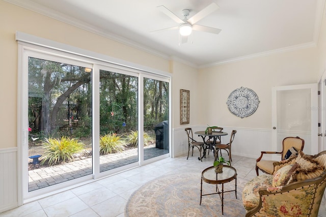 sitting room with light tile patterned flooring and ornamental molding