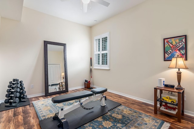 workout area with dark wood-type flooring and ceiling fan