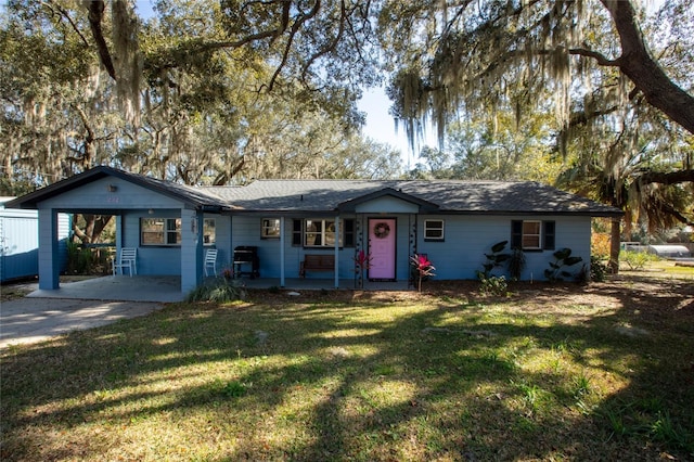 single story home with a carport and a front yard