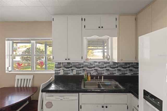 kitchen featuring tasteful backsplash, white appliances, tile counters, and sink