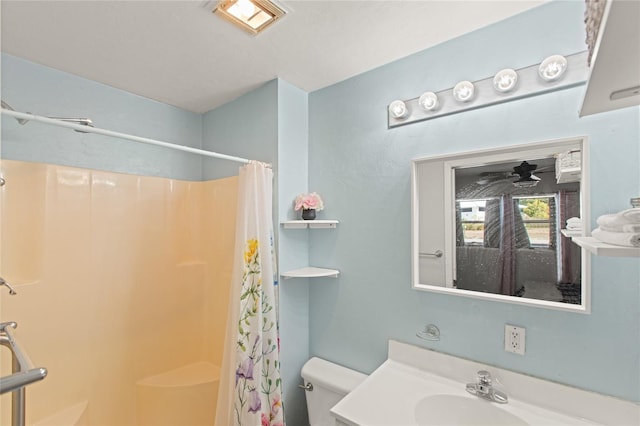 bathroom featuring vanity, toilet, and a shower with shower curtain