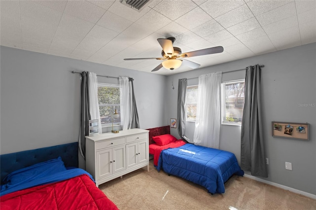 bedroom with light colored carpet and ceiling fan